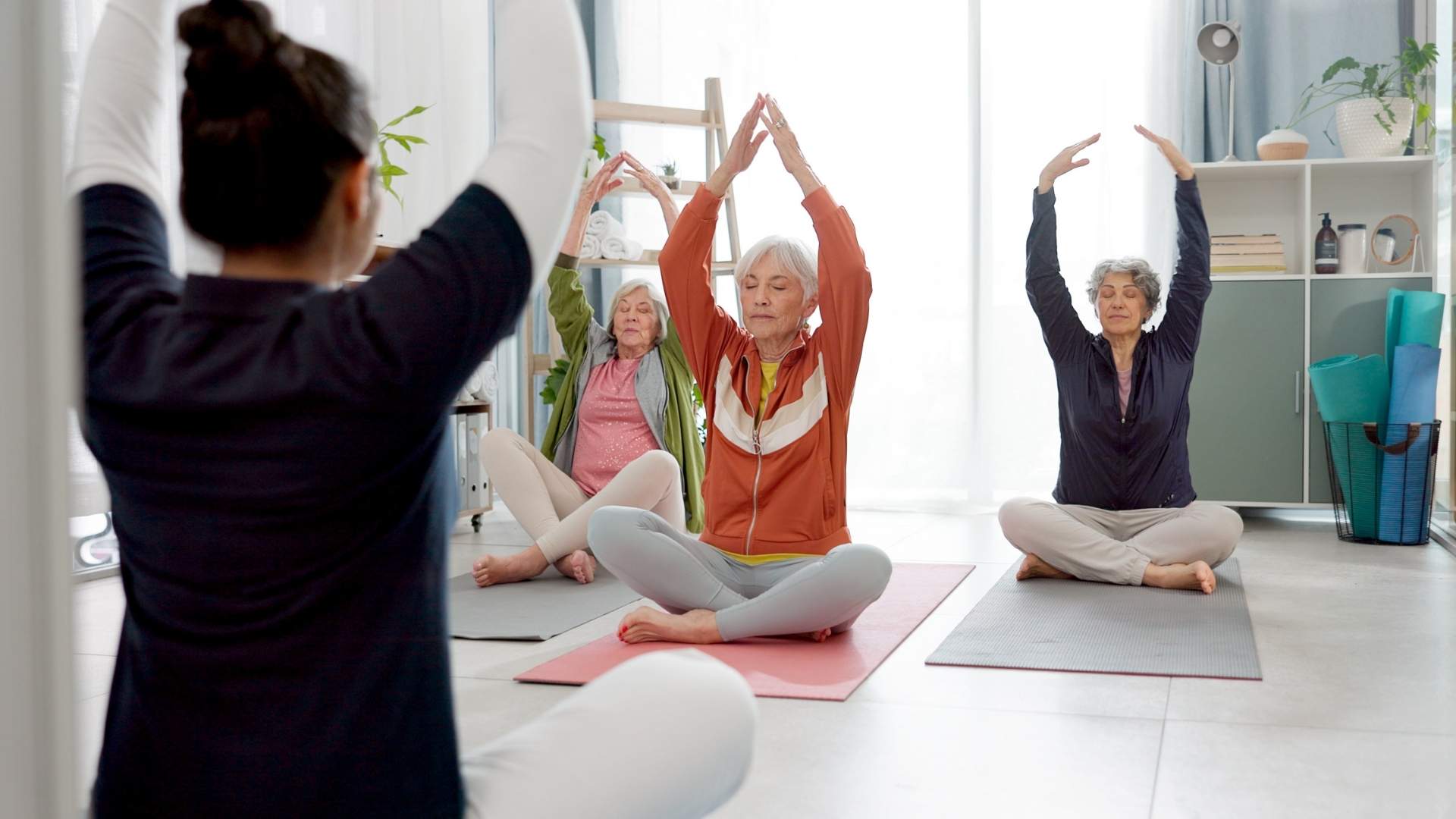 A group of seniors doing yoga together