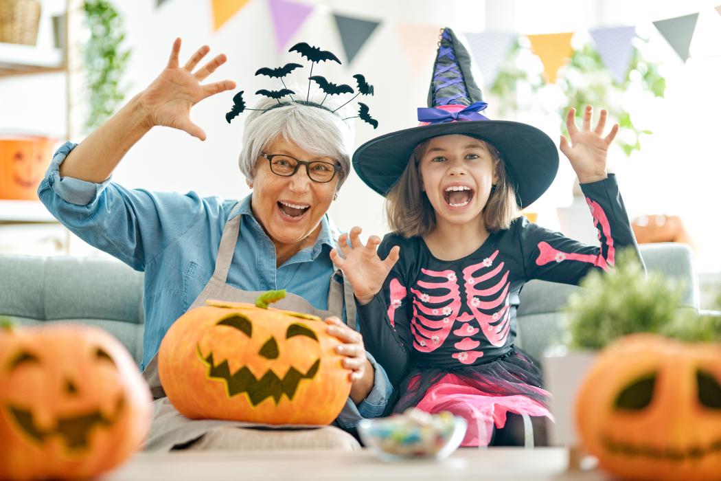 a senior woman a child celebrating halloween